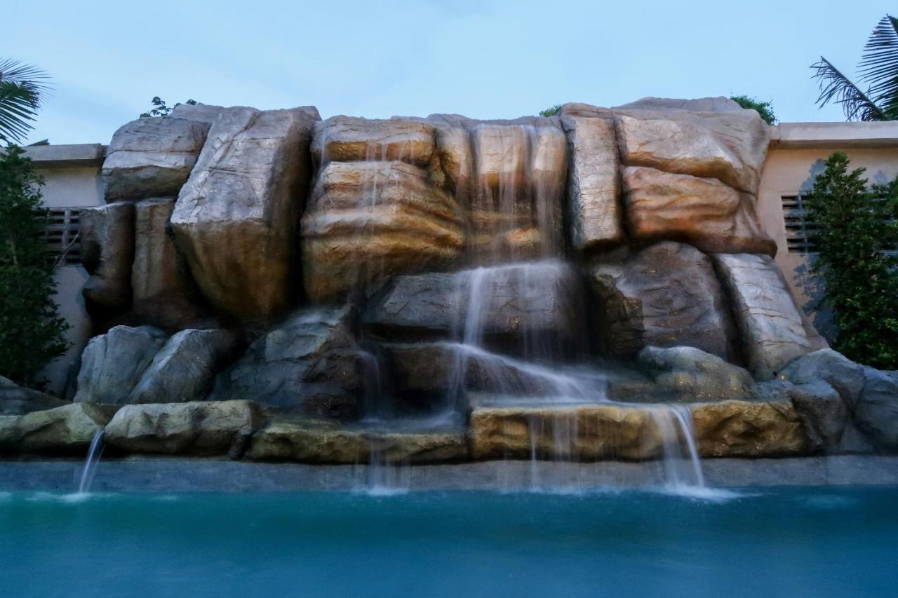 Craft Resort & Villas, Phuket Town Экстерьер фото The waterfall at the resort